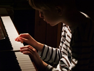 child playing at keyboard